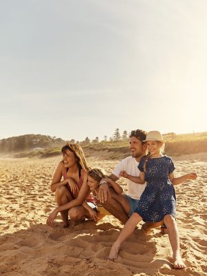 Shot of a young family sitting on the beachimage806237.jpg